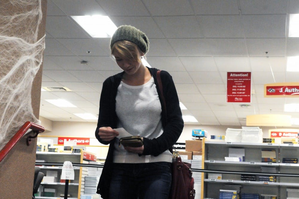 Sarah Zachry checks her text book list at the UNM Bookstore Tuesday, Oct. 27, 2015.&nbsp;The Affordable College Textbook Act is a proposed grant that would give students the ability to access free text books online.&nbsp;