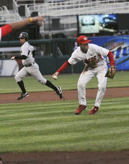 UNM's Dane Hamilton fields the ball and looks to fire it to first on Friday at Isotopes Park. The Lobos earned a 2-1 series win, but lost 1-0 to SDSU Friday night. 