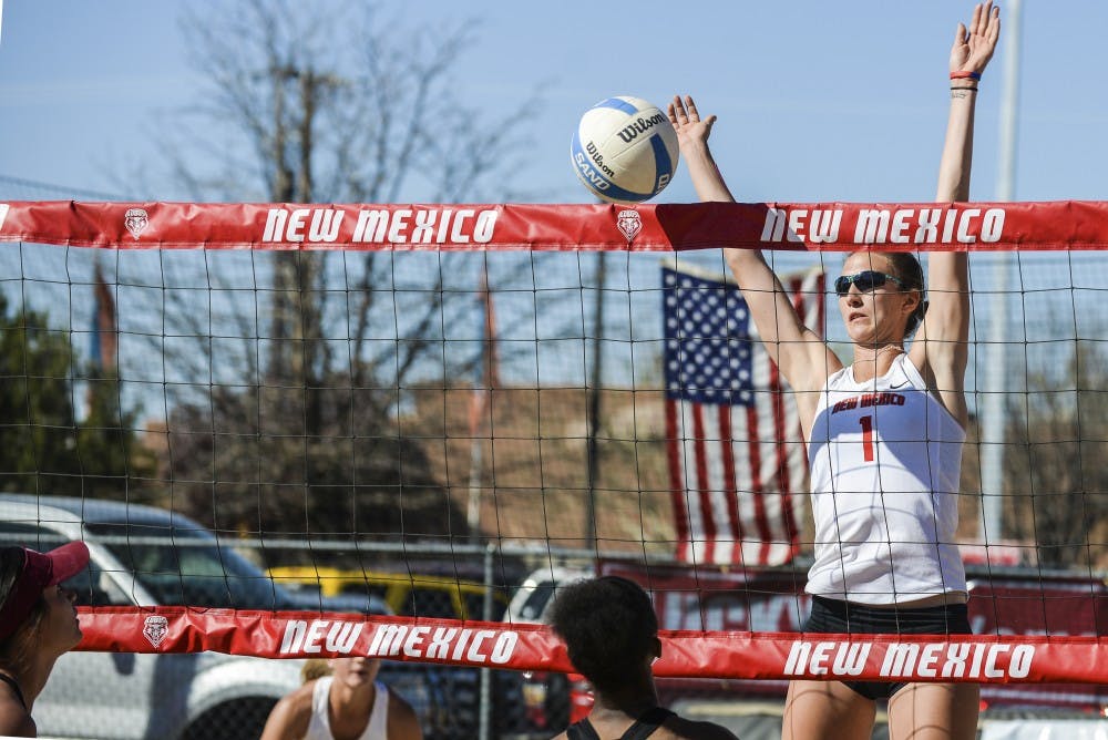 Junior Devanne Sours jumps to the net to block an off speed shot by a New Mexico State player on Saturday, March 19, 2016 at Luck 66 Bowl’s sand volleyball courts. The Lobos will compete in the Wildcat Spring Challenge in Tucson, Arizona this weekend.