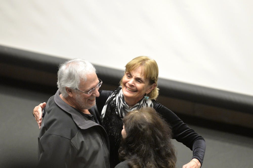 Anne Hillerman greats friends and attendees for her lecture at George Pearl Hall Thursday night. Hillerman shared sections from her father's books, Tony Hillerman, and her own while trying to convey the importance of fiction.