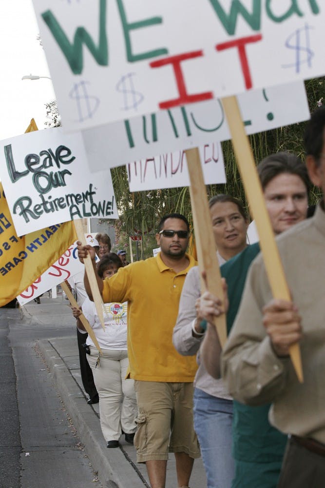 	UNM Hospital workers protest outside the hospital on Aug. 10. They picketed for increased wages and benefits. 