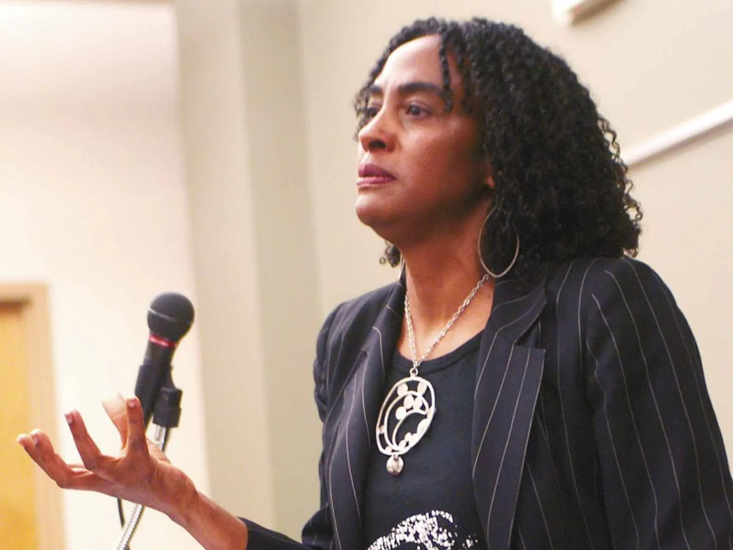 Loida Maritza Perez explains a poem by Paula Gunn Allen before reading it at the SUB on Friday during the Paula Gunn Allen Benefit weekend.