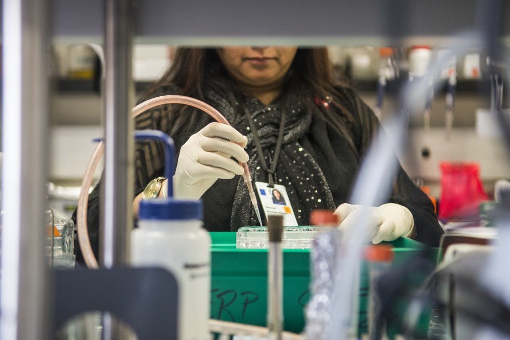 Associate Scientist Geetanjali Sharma works in Eric Prossnitz’s lab on Friday, Feb. 17, 2017 at the Cancer Research Center. Prossnitz and his team are conducting research related to aging and cancer, and how to slow down the development of both.