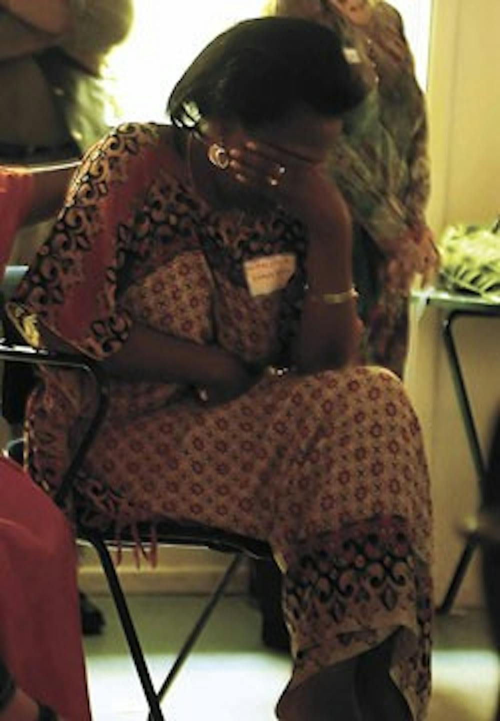 Wanjala Sio, mother of UNM lecturer Chao Sio, cries after hearing a poem about her daughter and the U.S. immigration system Tuesday at the Albuquerque Center for Peace and Justice. Chao was arrested on Sept. 14 by U.S. Immigration and Customs Enforcement.