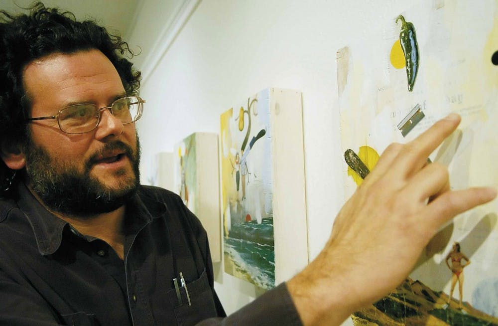 Artist David Nakabayashi points out a grade school award he received that is collaged into his work titled "I'd Rather Be Swimming" on Friday at the Yale Art Center. 