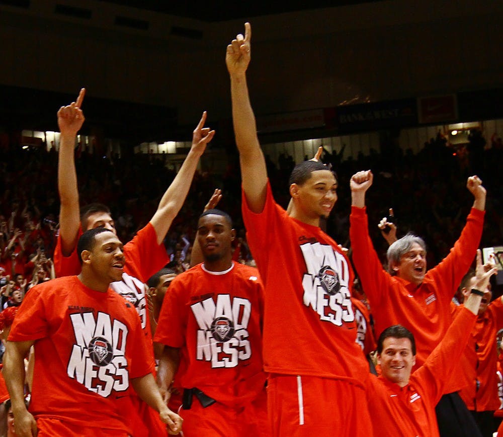 	Darington Hobson joyously celebrates on Selection Sunday after the Lobos found out who they’d play in the NCAA Tournament . UNM will face Montana on Thursday.
