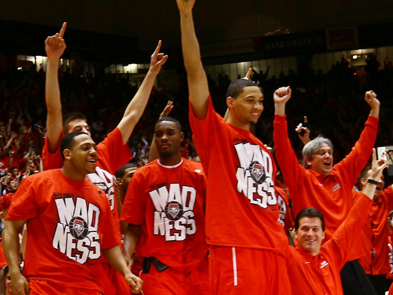 Darington Hobson joyously celebrates on Selection Sunday after the Lobos found out who they’d play in the NCAA Tournament . UNM will face Montana on Thursday.