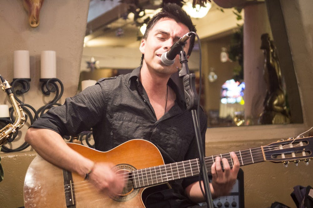 Diego Manrique, senior Music major, plays at Hacienda del Rio restaurant in Albuquerque’s Old Town on Oct. 21. Manrique and three other students formed a latin music band called Sol de La Noche to play at different restaurants and locations.