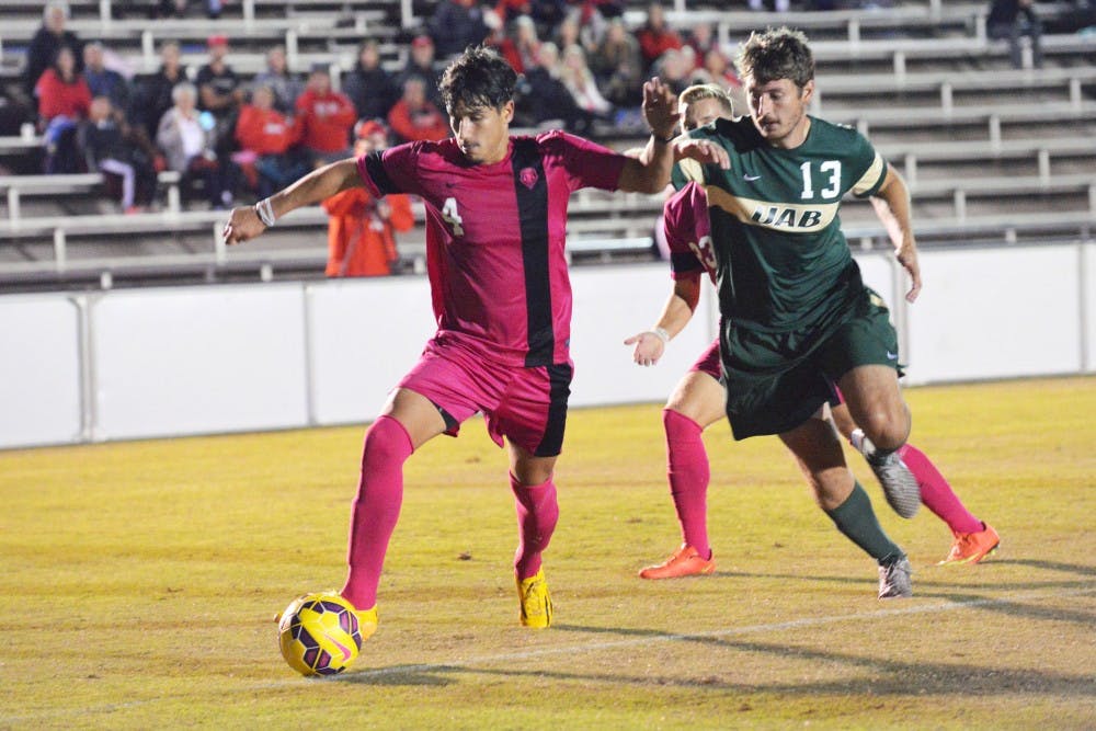 UNM midfielder Francesco Casucci defends the ball from a UAB player at the UNM Soccer Complex Sunday, Oct. 18, 2015. The Lobos beat UAB 3-2. 