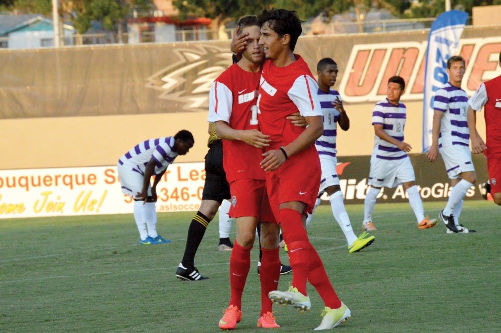 Chris Wehan and Francesco Cassuci congratulate each other during an exhibition game against Grand Canyon University on Aug. 19. The Lobos play at top-ranked UCLA this Saturday for the season opener.