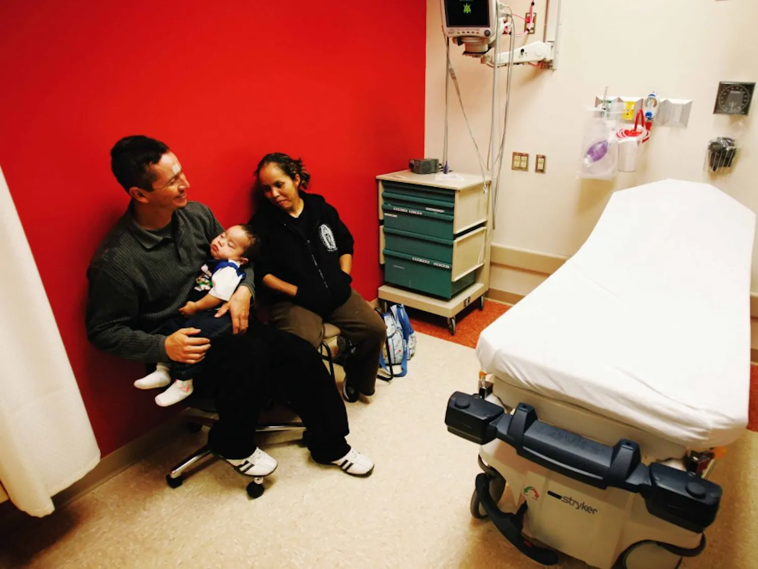 Omar Garcia and Teresa Herrera, parents of Omar Garcia Jr., wait at the pediatric unit of the Barbara and Bill Richardson Pavilion on June 9. Admitted for a fever, Omar Jr. is the first patient to be treated at the new pediatric unit.