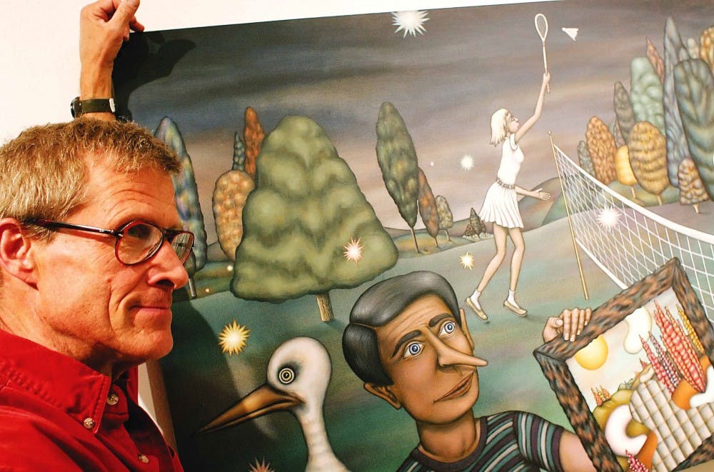 Local artist Mike Hart stands next to his painting "Nite Games" on Friday at the Yale Art Center. 