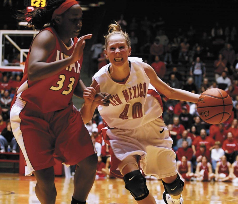 UNM guard Brandi Kimble dribbles past Utah's Marie Warner in the second half of Sunday's game against Utah at The Pit. The Lobos lost 49-48. 