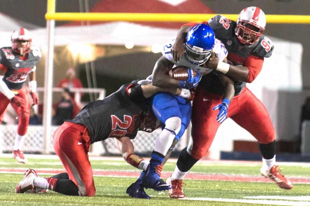 New Mexico linebacker Ryan Langford (20) and defensive end William Udeh (92) stop Boise State running back Jay Ajayi (27) during the game on Nov. 8. Colorado State will host New Mexico on Saturday in Fort Collins, Colorado, where the Lobos will look to spoil the No. 22 Rams’ season.