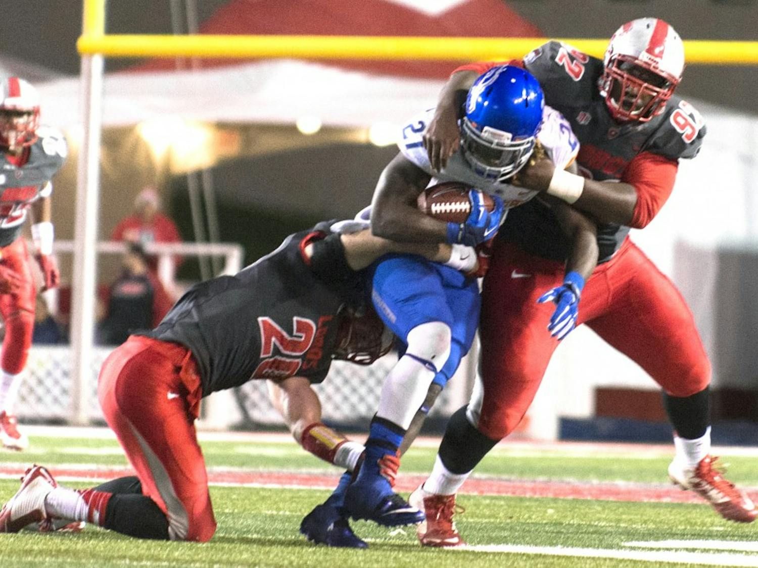 New Mexico linebacker Ryan Langford (20) and defensive end William Udeh (92) stop Boise State running back Jay Ajayi (27) during the game on Nov. 8. Colorado State will host New Mexico on Saturday in Fort Collins, Colorado, where the Lobos will look to spoil the No. 22 Rams’ season.