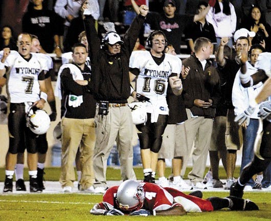 Lobo wide receiver Marcus Smith lies on the ground after missing a catch on a fourth down play with less than two minutes left in Saturday's 14-10 loss to Wyoming at University Stadium.