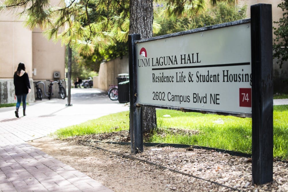 A student walks through Laguna Hall, a complex of dorms located on UNMs Main Campus. Incoming freshman will be required to live on, or near UNM Main Campus.