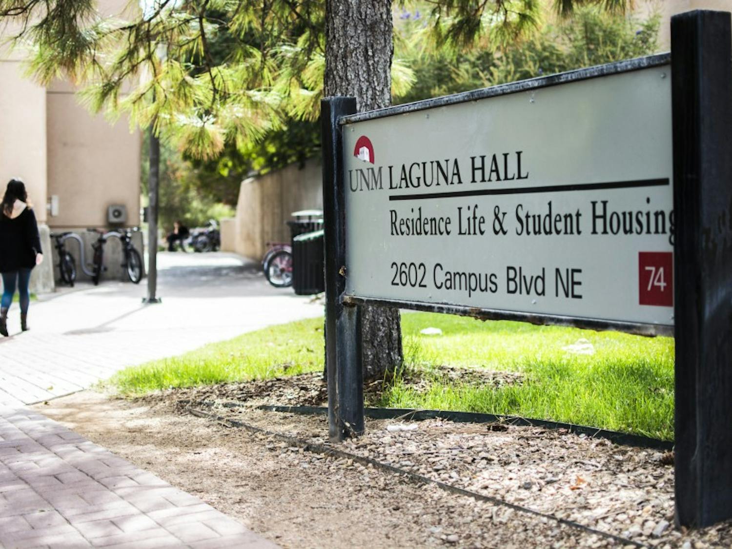 A student walks through Laguna Hall, a complex of dorms located on UNMs Main Campus. Incoming freshman will be required to live on, or near UNM Main Campus.