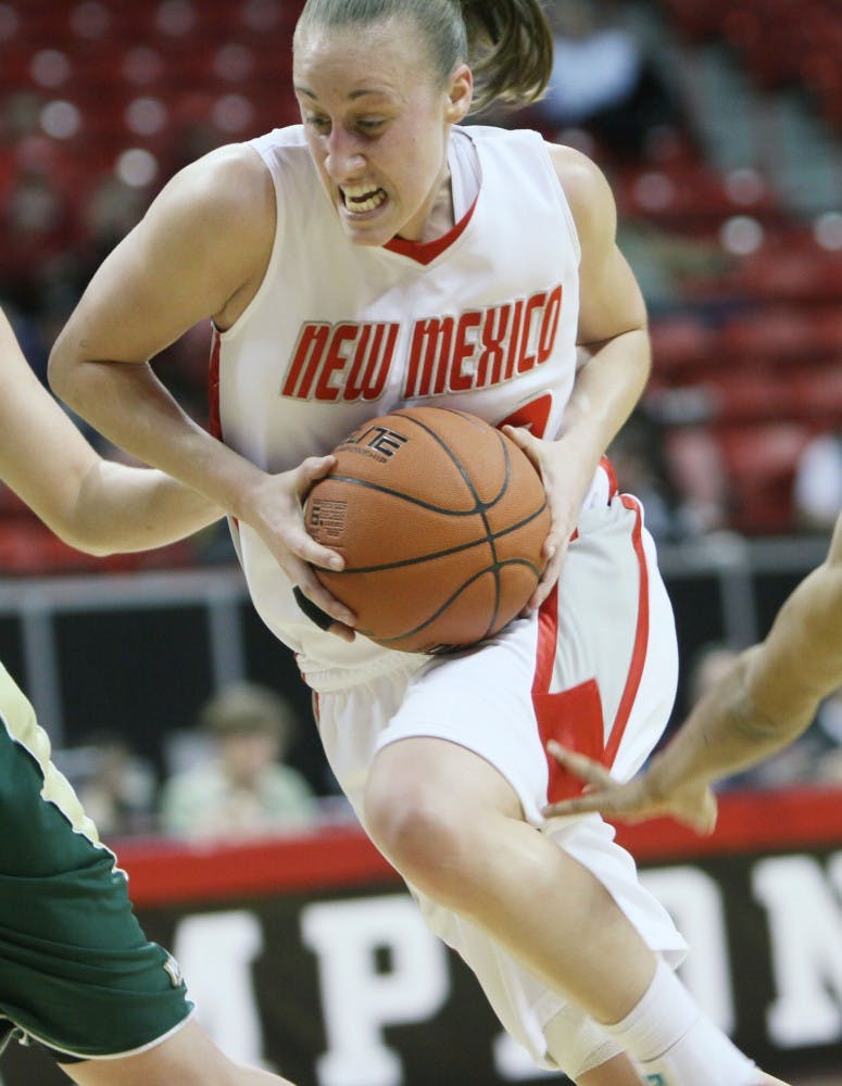 	Sara Halasz slashes past Colorado State’s Kim Mestdagh, left, and Chantel Kennedy, during the Lobos’ 67-54 victory over Colorado State. UNM will face Utah today.