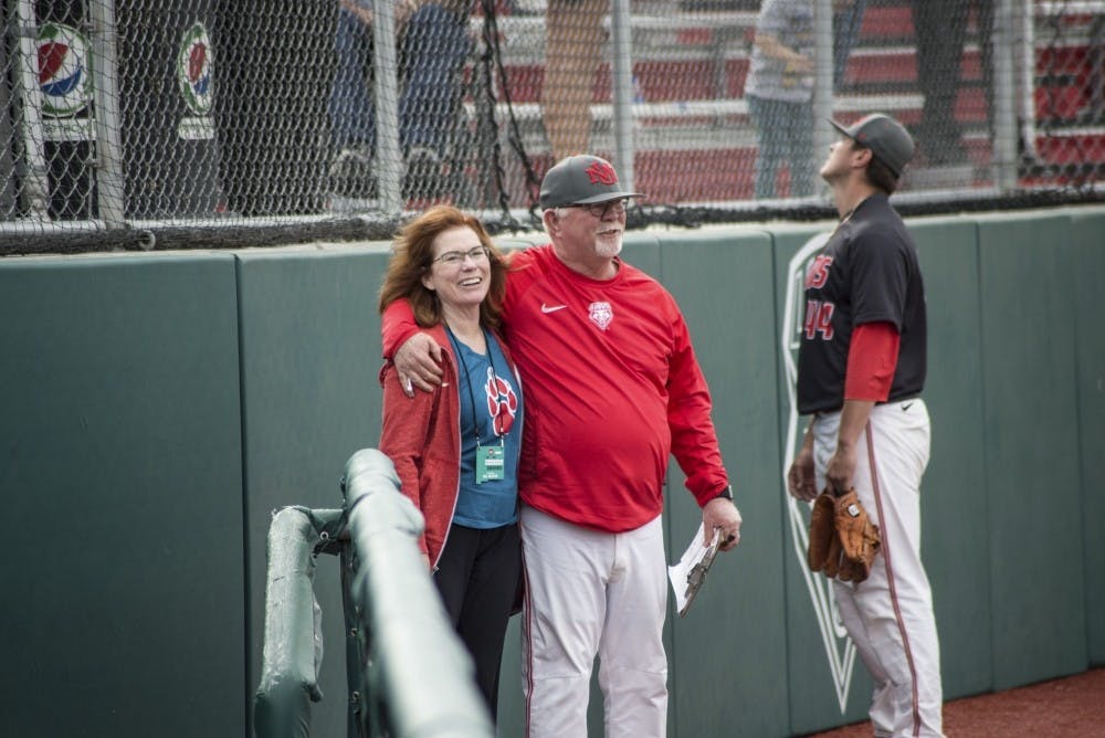 UNM President Garnett Stokes and head baseball coach Ray Birmingham chat following the Lobos' win at Santa Ana Star Field on March 25, 2018.