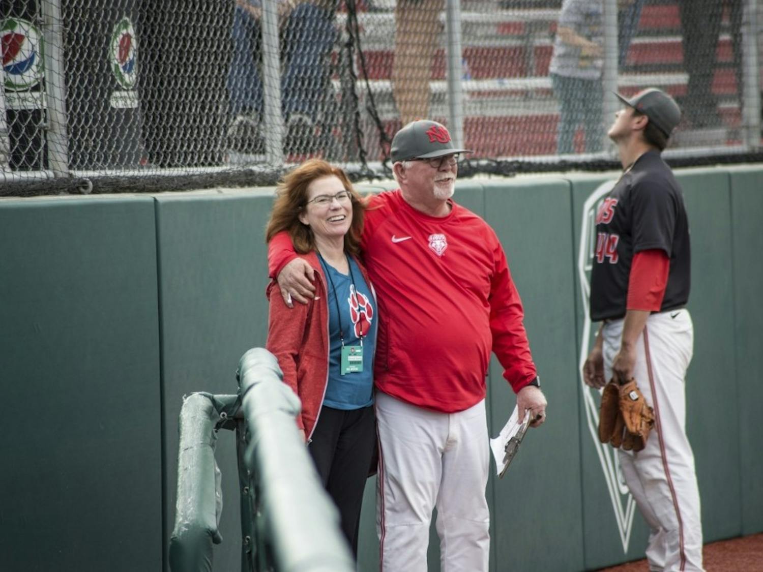 UNM President Garnett Stokes and head baseball coach Ray Birmingham chat following the Lobos' win at Santa Ana Star Field on March 25, 2018.