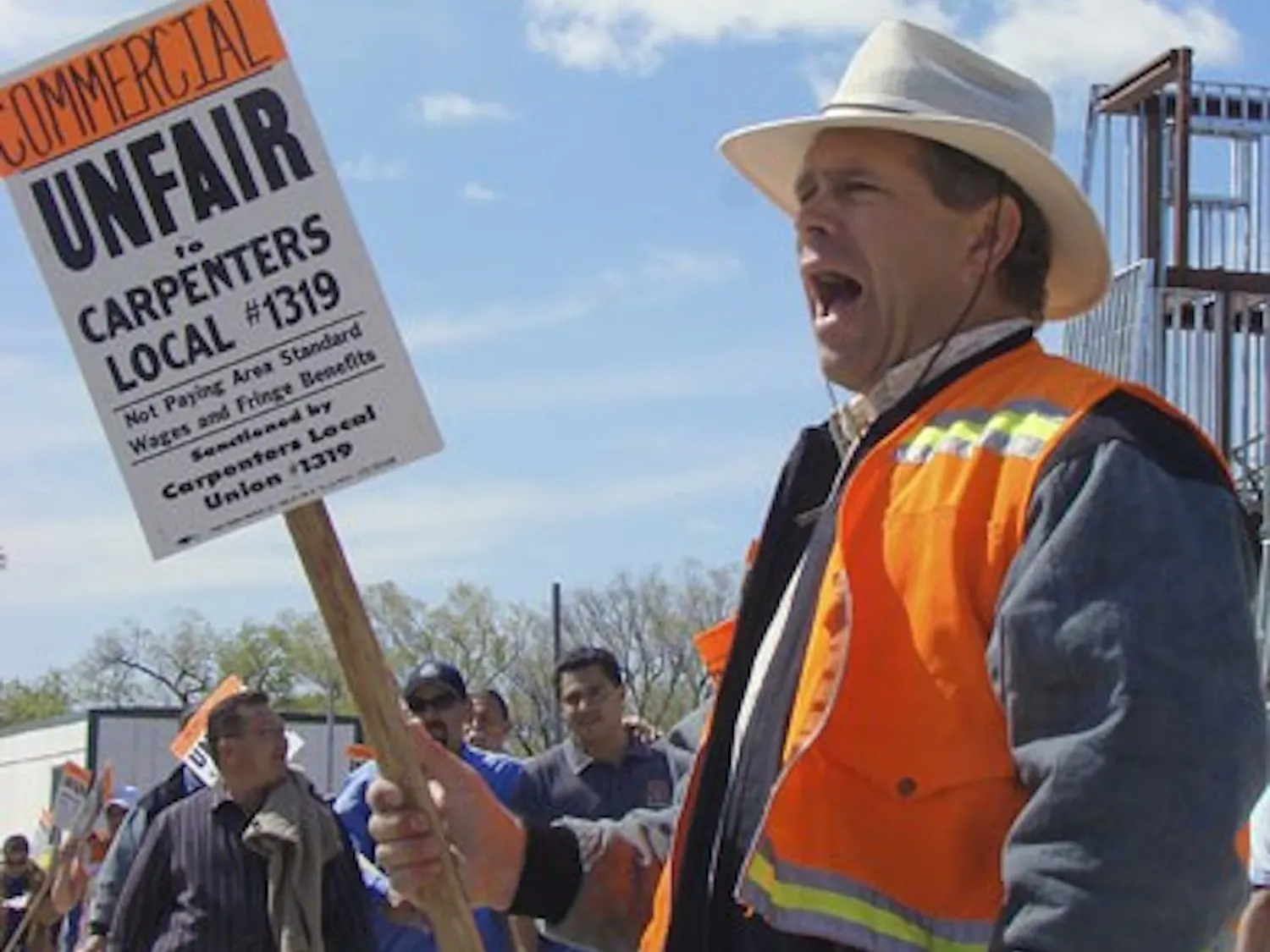 Protester Jerry Vlach yells during a demonstration on North Campus on Wednesday. The event was organized by the Southwest Regional Council of Carpenters, which represents workers in five states. The group is involved in a labor dispute against Commercial