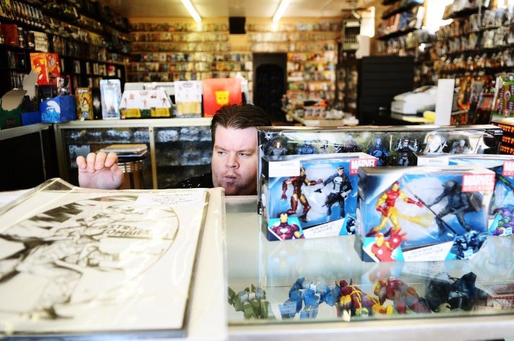 	Sean “Squid” Banning mans the counter at Astro-Zombies. The comic shop was voted the best in the city for the last nine years. 