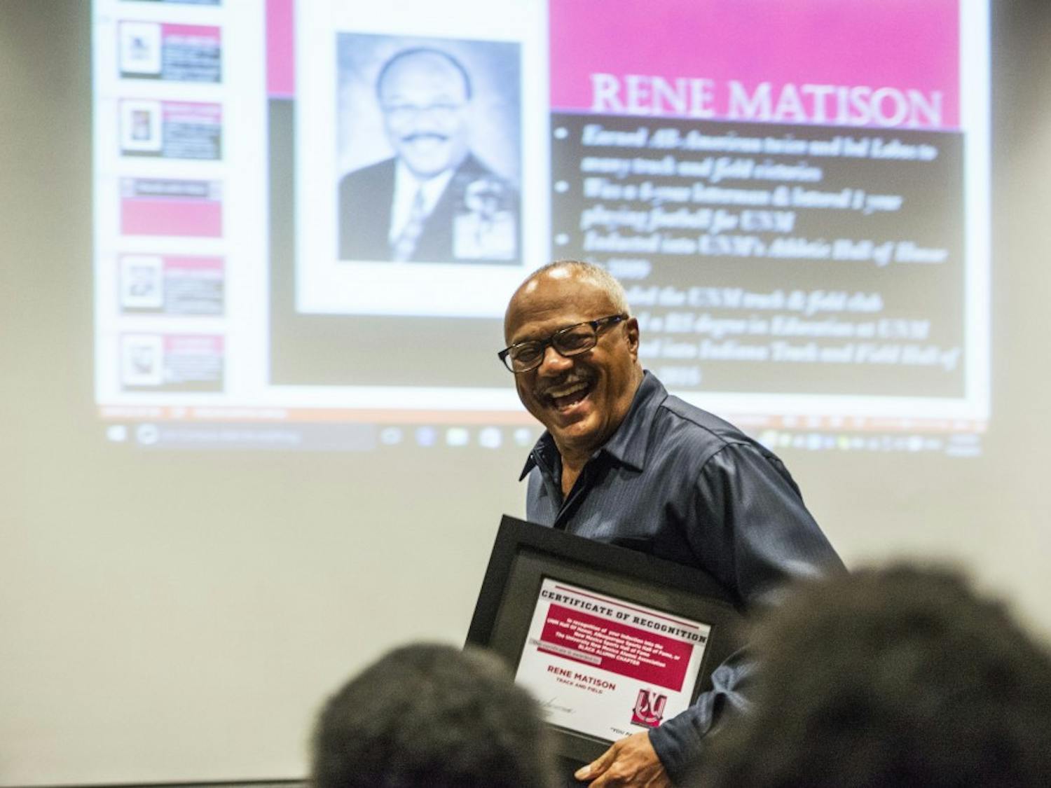 Rene Matison receives his award on Friday, Sept. 30, 2016 at the Centennial Engineering Auditorium. Matison, alongside a handful of other African-American UNM alumni, gathered for a ceremony to recognize their collegiate and athletic accomplishments.