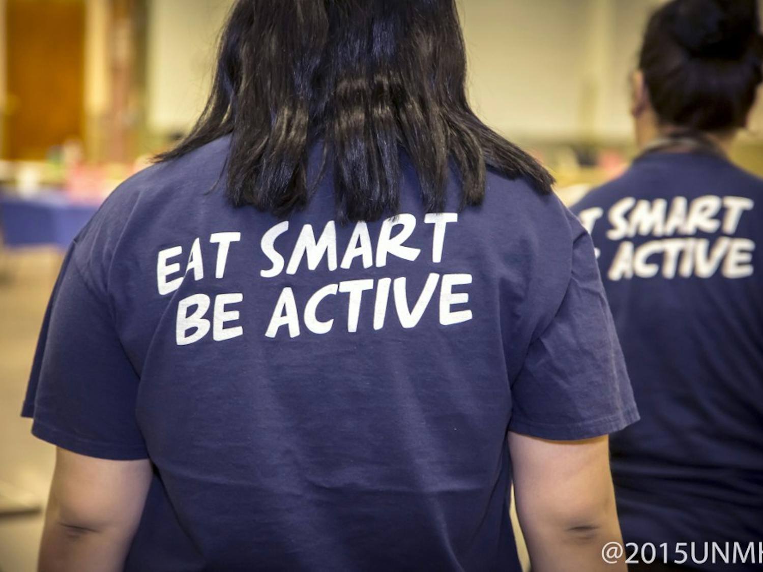 Participants of the Family Fit Challenge wear matching tea shirts that have the "east smart be active" slogan on them. The challenge is a nine week program that is intended to help families stay active with workouts and activities. 
