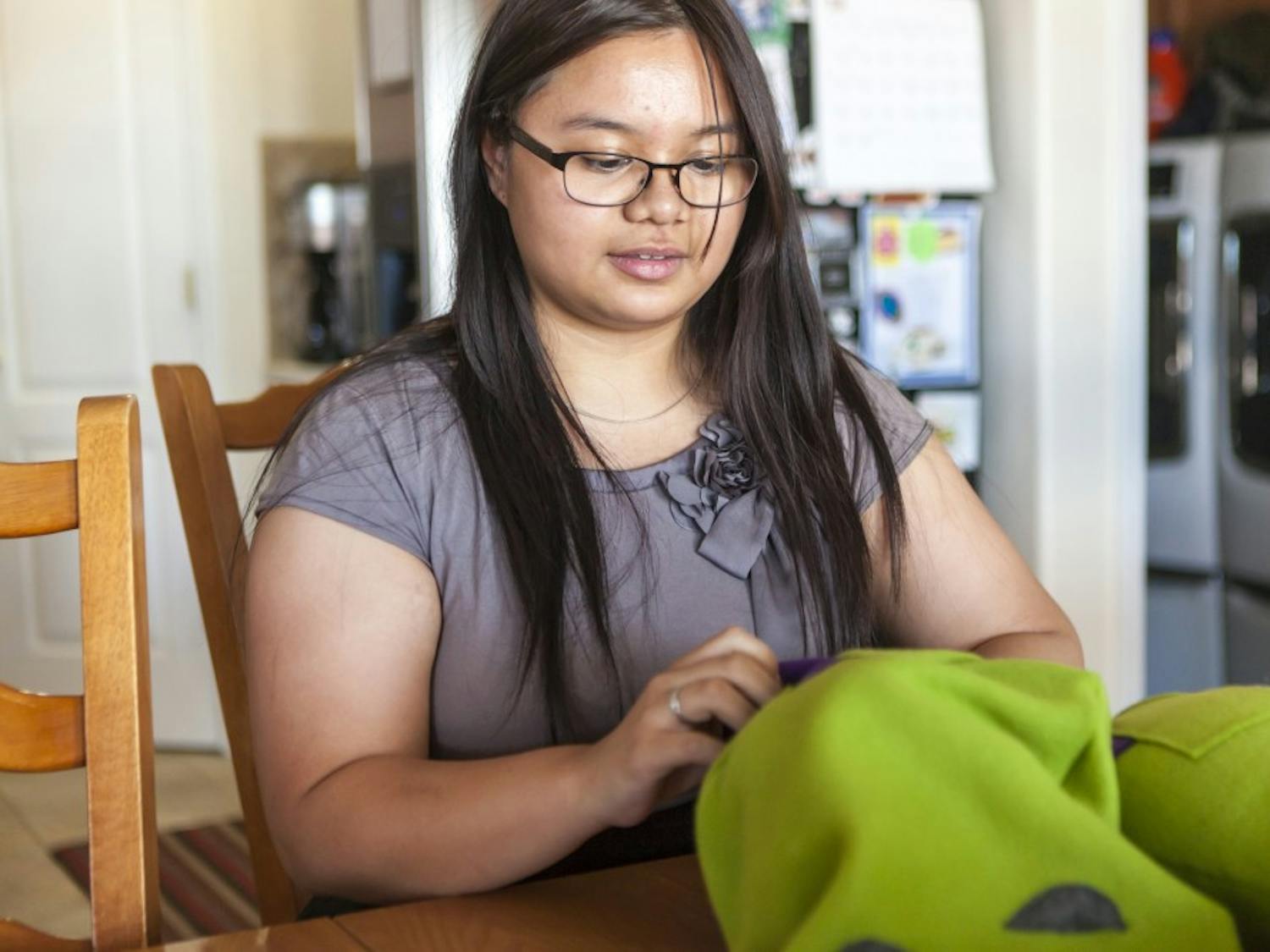 Avery Lopez, an engineering student at UNM, prepares the plush toys that she has manufactured for the ACE convention on Saturday, June 28. Lopez has turned her house into a plush toy factory after taking the advice from her professor to find a hobby.