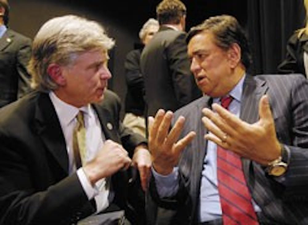 Gov. Bill Richardson talks to Dale C. Alverson, medical director for the Center for Telehealth and Cybermedicine Research, about New Mexico's future use of the LambdaRail system after a press conference at UNM's Media Arts Center on Friday.  