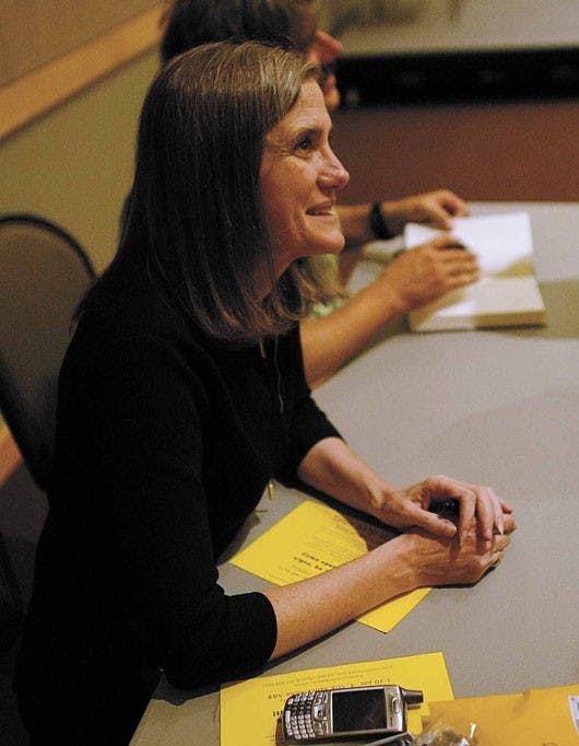 Broadcast journalist and author Amy Goodman waits to sign copies of her new book, Static, after a presentation in the SUB on Thursday. 