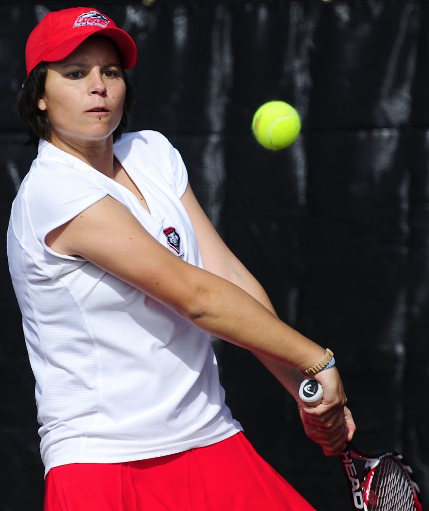 	Anya Villanueva, seen here blasting a ball crosscourt, brings two years of college experience to an otherwise young UNM women’s tennis team. The Lobos will look to overcome their youth in the spring season.