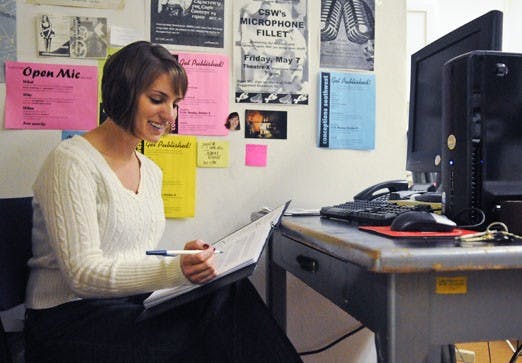 Jennifer Olson edits a fiction piece in Marron Hall on Monday for Conceptions Southwest. 