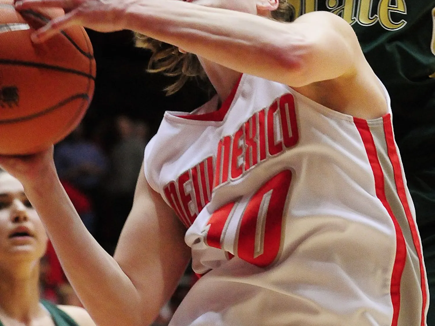 Amy Beggin drives past a slew of Colorado State defenders. The Lobos will face Colorado State on Tuesday in the Mountain West Conference tournament.