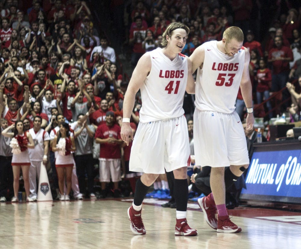 	Former New Mexico forward Cameron Bairstow and center Alex Kirk take their final walk off the Pit floor during the last home game on March 5 against Air Force. Bairstow and Kirk signed with the Chicago Bulls and Cleveland Cavaliers, respectively, over the summer.