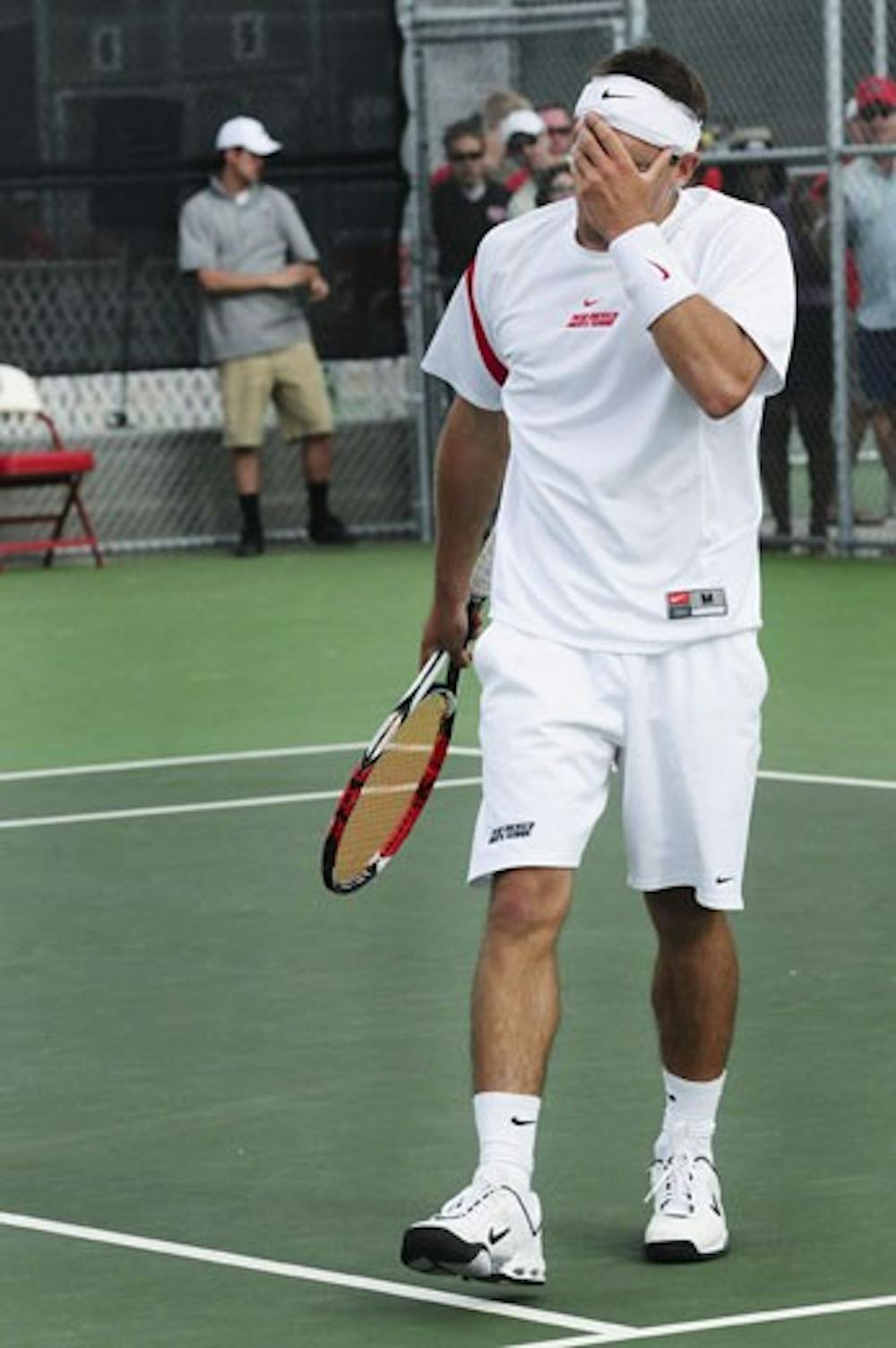 In this file photo, Johnny Parkes walks off the tennis court in disgust. But Parkes will be the lone Lobo representing UNM in the NCAA singles competition set to start on May 20.