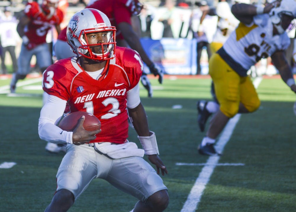 Lobo redshirt freshman quarterback Lamar Jordan looks for an opening, in an attempt to score a touchdown, during the last home game against Wyoming at University Stadium on Saturday afternoon. 