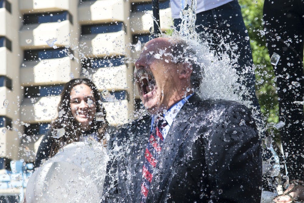 	Albuquerque Mayor Richard Berry gets doused with water as part of the Ice Bucket Challenge Thursday at Civic Plaza. Berry became the latest to participate in the viral video event that has drawn awareness to ALS, commonly known as Lou Gehrig’s disease.