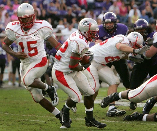 Lobo quarterback Donovan Porterie hands off to tailback Paul Baker last season against TCU. Porterie and Baker will be counted on to lead a young UNM offense next season. 