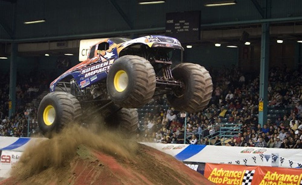 Sudden Impact, driven by Jon Zimmer, jumps a dirt ramp at Monster Jam on Sunday at Tingley Coliseum.