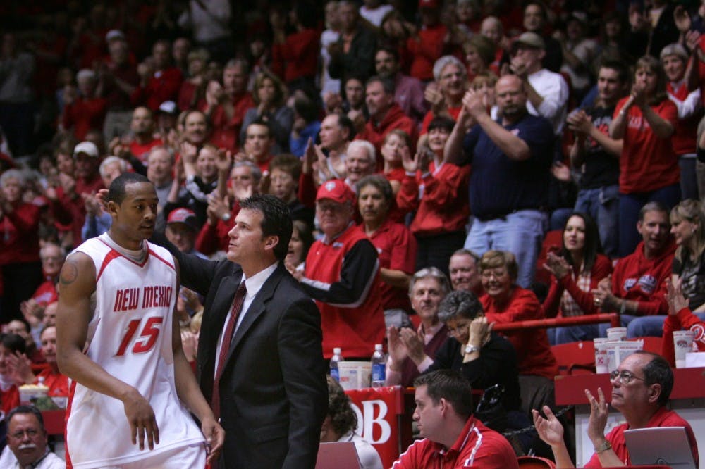 J.R. Giddens, greeted by head coach Steve Alford, receives a standing ovation as he leaves the game with a career-high 36 points Saturday at The Pit. 