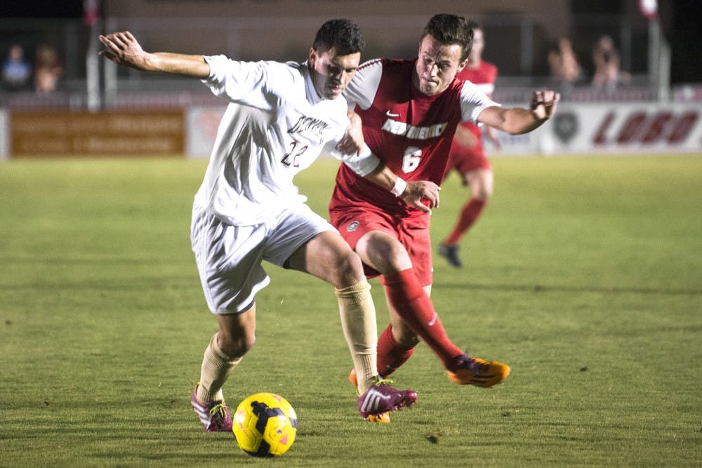 	New Mexico men’s soccer midfielder Ben McKendry, right, battles for possession against Denver’s Jordan Schweitzer on Saturday. The Lobos play Akron at the UNM Soccer Complex today at 7 p.m.