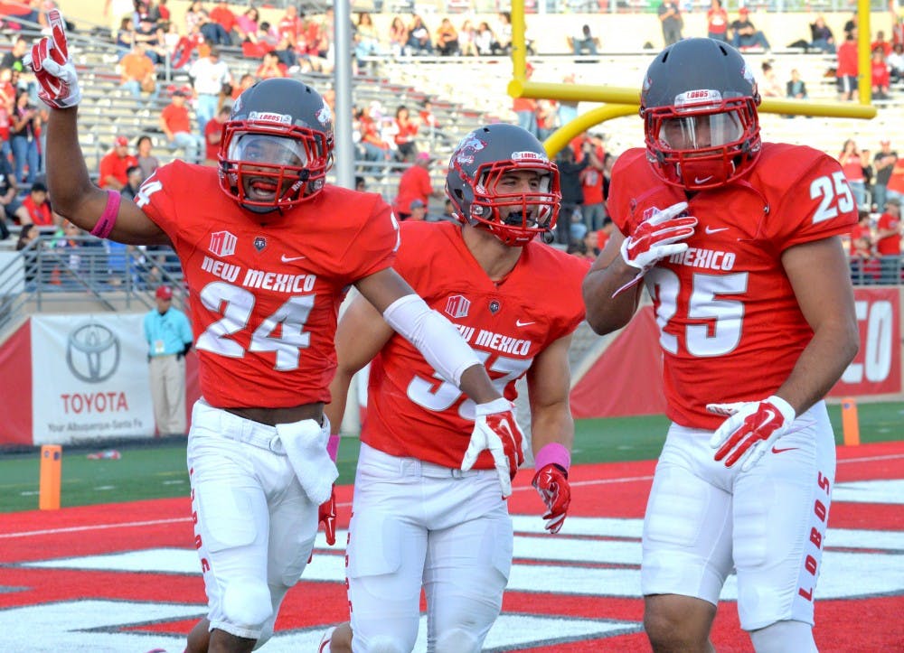 Senior running back Carlos Wiggins (24) celebrates with his teammates after running a 100-yard kick off return against the University of Hawaii at University Stadium Saturday. Wiggins was named Mountain West Special Teams player of the week. 