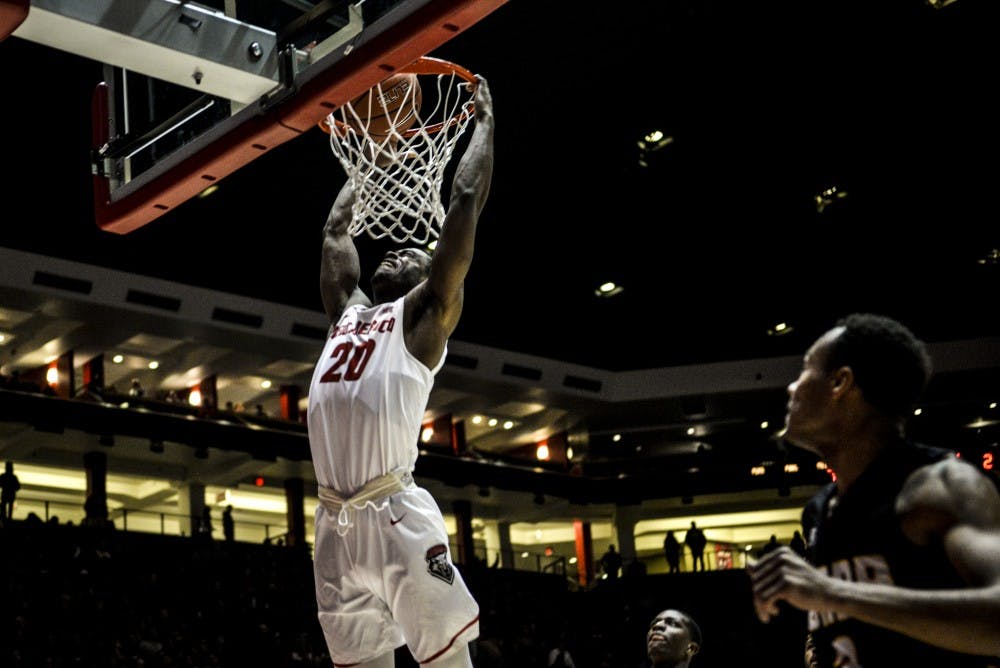Junior guard Sam Logwood dunks the ball during a break away against the Arkansas-Pine Bluff Golden Lions Saturday, Dec. 17, 2016 at WisePies Arena. The Lobos dominated the Golden Lions ending the night with a 83-43 victory.&nbsp;