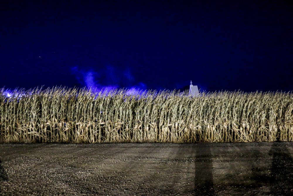 Shadows pass by cornstalks at McCall’s Haunted Farm in Moriarty. The 28th of October was the last day to go for a night of fright.