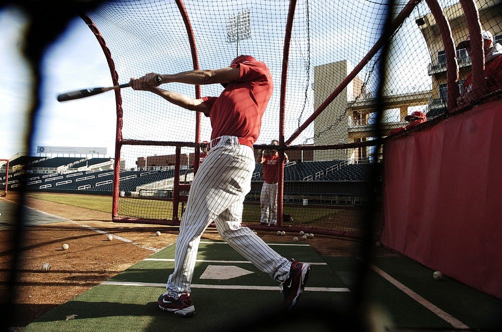 	Daniel Gonzalez puts full-force power in the batting cage during practice on Wednesday at Isotopes Park.