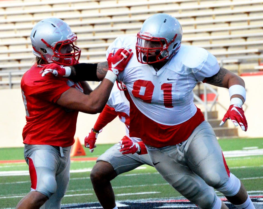 New Mexico defensive lineman Nik D’Avanzo makes a move past an offensive player during an intrasquad scrimmage last Saturday. One thing defensive coordinator Kevin Cosgrove has been trying to instill in his players: a physical mentality. 