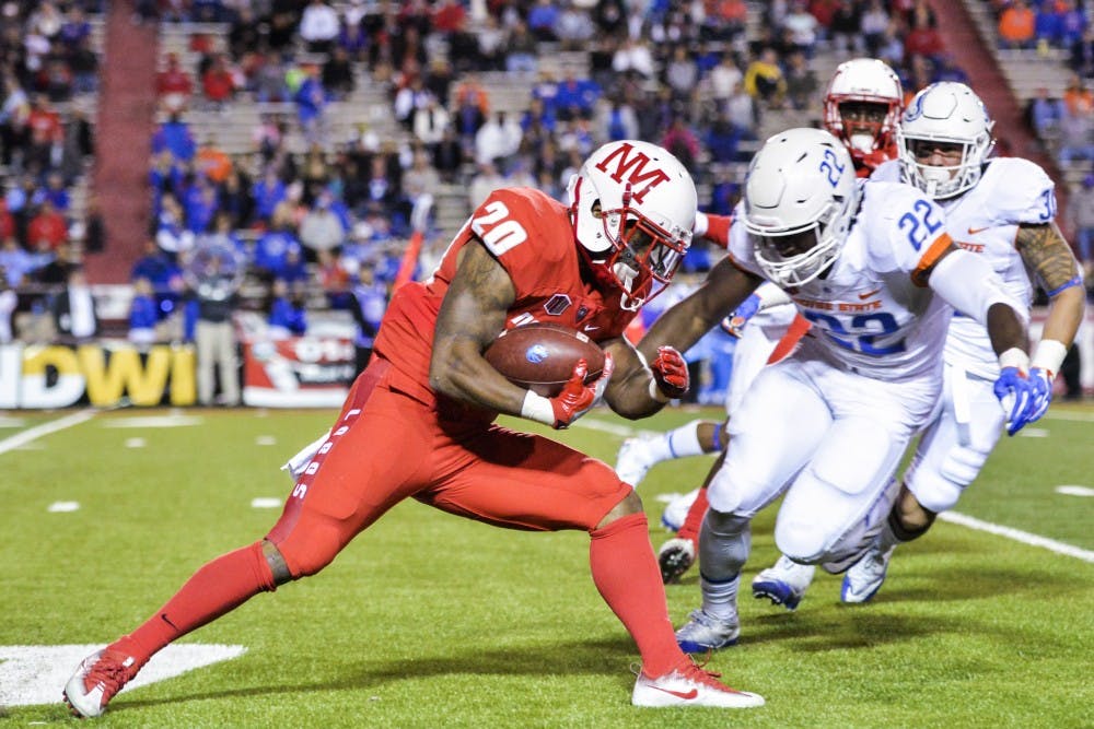 Junior running back Daryl Chestnut prepares to be tackled by Boise State defensemen during UNM's game on&nbsp;Friday, Oct. 7, 2016 at University Stadium. The Lobos will host ULM this Saturday in Albuquerque, New Mexico.