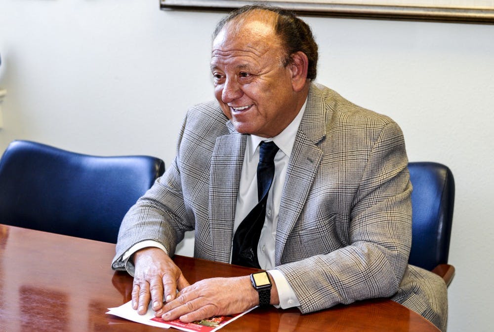Eliseo “Cheo” Torres smiles during an interview in his office at Scholes Hall on Oct. 31, 2017. Torres was inducted into the Hispanic Association of Colleges and Universities Hall of Champions on Oct. 28, 2017.